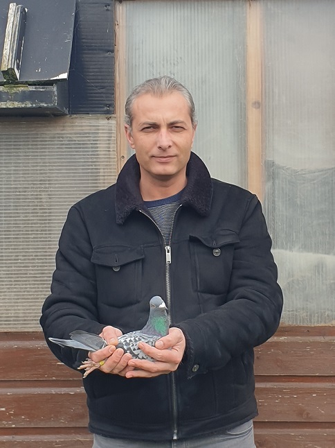 Bogdan Stroe holding one of his race birds. 09 03 21