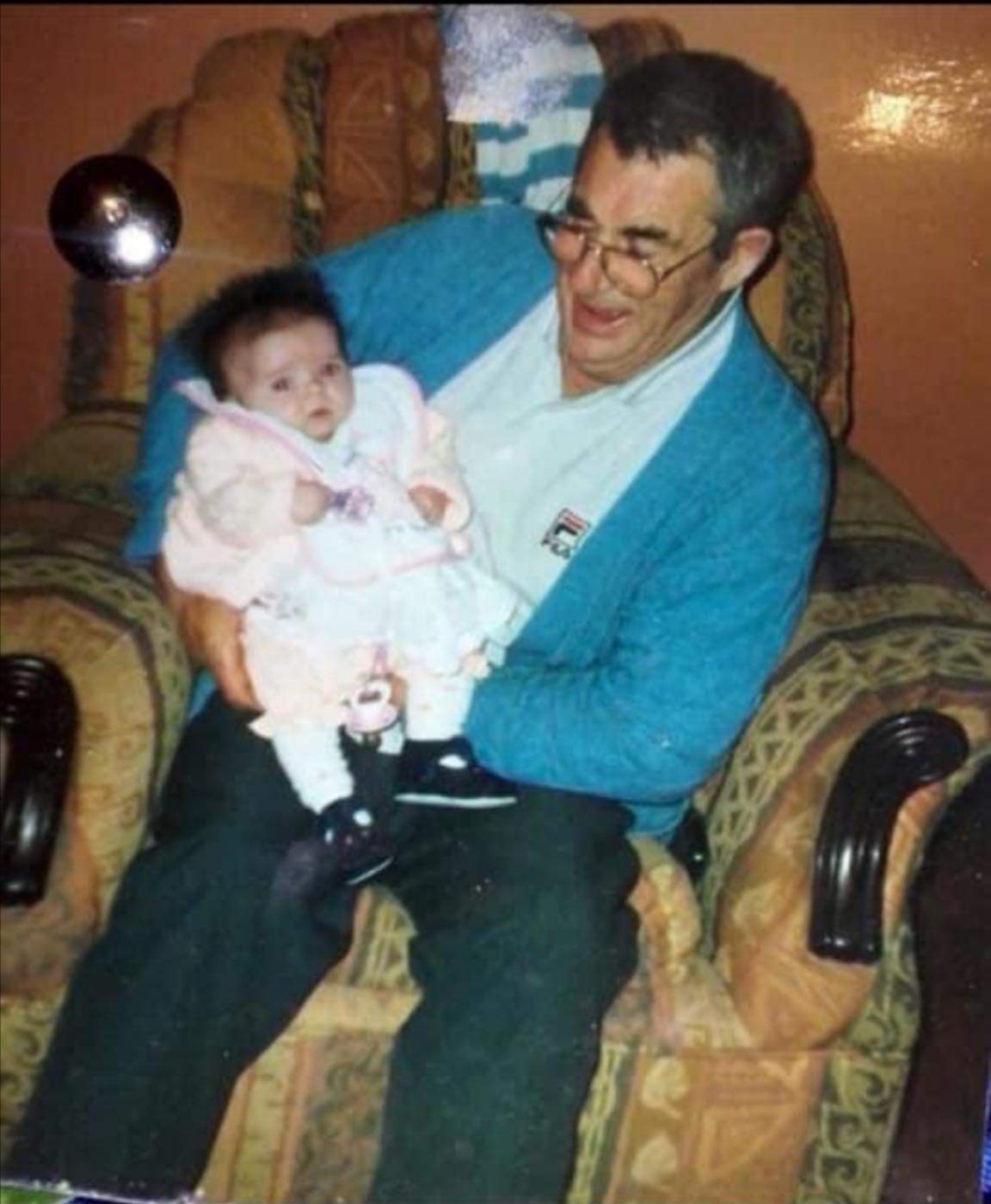 John Kenny proudly holding in his arms his granddaughter Jade