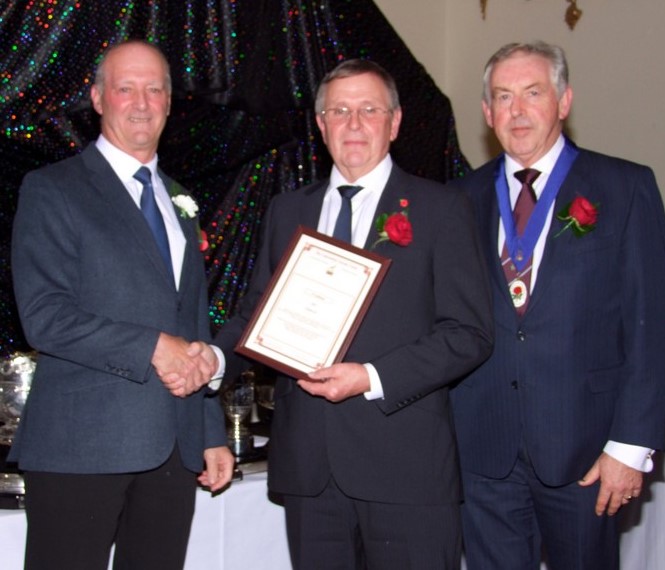 New Committee Member Peter Latham receiving his Diploma fro Chief Guest Chris Sutton. 23 11 21