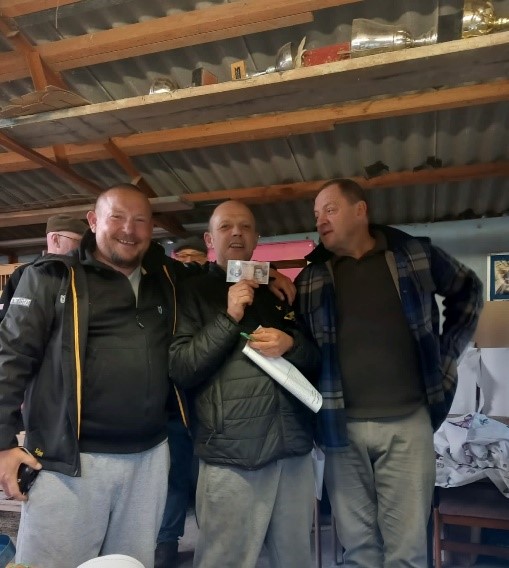 Pic 4 Laindons Marcin Grzedowicz handing runner up Jason Reeve his winnings witnessed by club winner Gary Watts