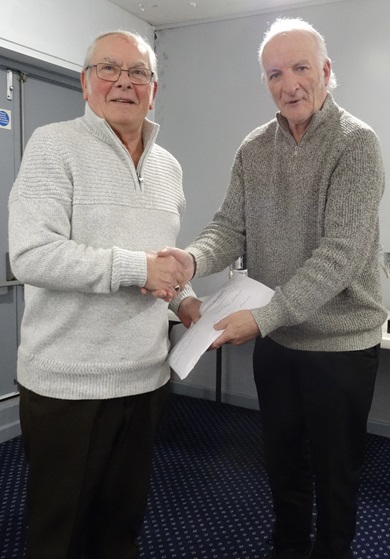 Mick Stone recieveng his prize money from Paul Adames. 17 12 24a