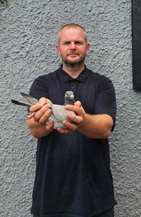 Michael Monaghan of OM Monaghan holding their Section D Winner from Cloughmartin 10 09 25Z